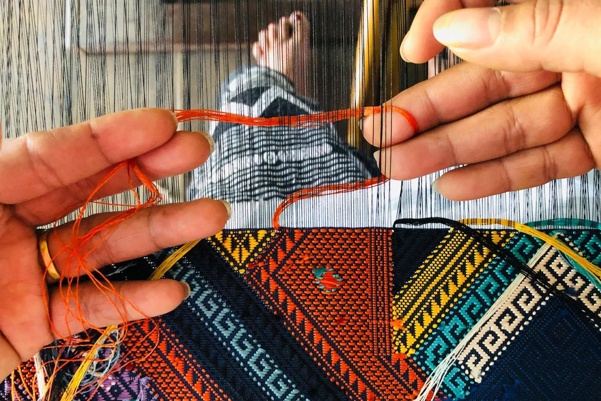 ock pop tok laos home hand weaving working closeup - Discover Laos Through textiles