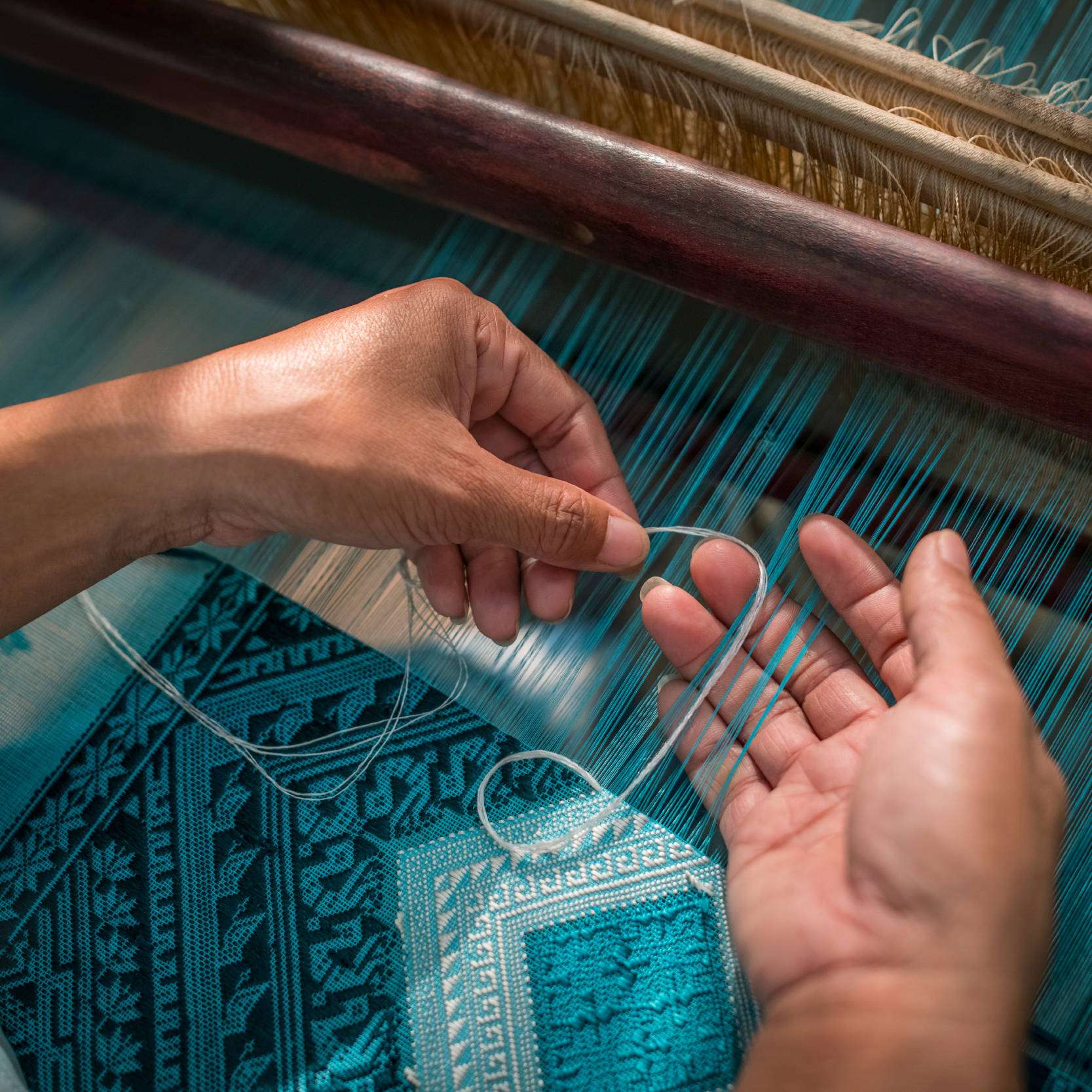 ock pop tok weaving hand closeup detail mobile - Discover Laos Through textiles